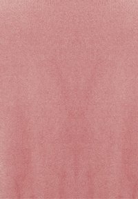 Texture douce en cuir suédé rose pâle avec un grain naturel subtil et des variations de teinte et de motif de surface.