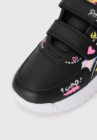 Black leather sneaker featuring a rounded toe, hook-and-loop straps, colorful graphics including hearts and the word "ciao," and a white sole.