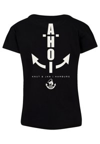 Black cotton t-shirt featuring white text "AHOI" and arrows on the back, along with "Knut & Jan | Hamburg" and a sailor graphic.