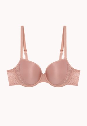 Soutien-gorge rembourré rose clair avec des accents en dentelle sur les côtés. Matériau lisse semblable à du satin avec des bretelles ajustables et une forme courbée.
