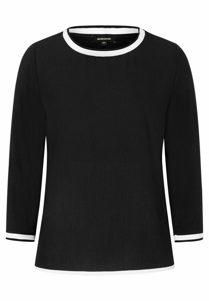 Black long-sleeve top with a round neckline, featuring white trim along the collar and sleeve cuffs. Smooth fabric, relaxed fit.