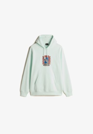Mint green hoodie with a front pocket. Features a graphic design of a skeleton against a brick wall, with red and blue accents.