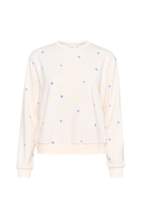 Krämfärgad sweatshirt med långa ärmar, prydd med små blå hjärtan över hela plagget. Mjuk textur och ribbade ärmslut och midja.
