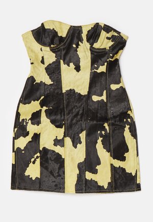 Top corsé de estampado de vaca negro y amarillo, con costuras estructuradas, escote en forma de corazón y tejido suave y texturizado.