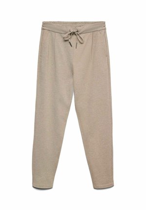 Béžové tepláky s nastavovacím pasem, dvěma bočními kapsami a zúženými nohavicemi. Látka má měkký, texturovaný vzhled.