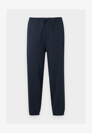 Pantalon de jogging bleu marine avec ceinture élastique, cordon de serrage ajustable, jambes fuselées et ourlets retroussés.