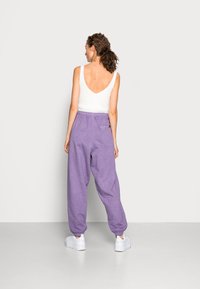 Ellesse VELAM - Calças de fato de treino - purple