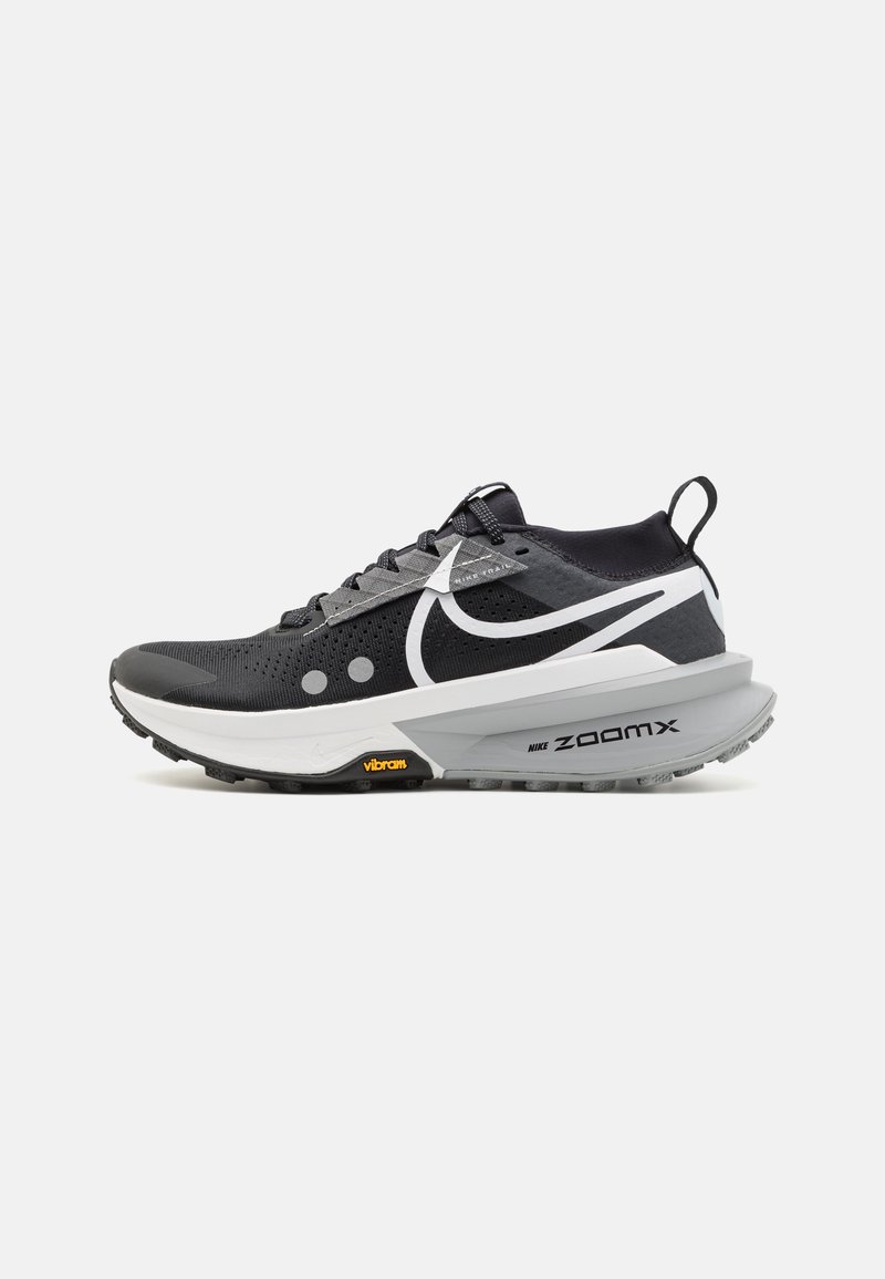 Black and gray running shoe with mesh upper, cushioned midsole, and rubber outsole featuring Vibram logo. Prominent Nike swoosh design.