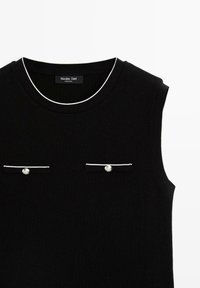 Black sleeveless top with a crew neckline, white trim, and two small pockets accented with silver buttons. Label visible at the neckline.