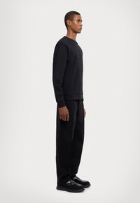 EA7 Emporio Armani FELPA UNISEX - Sportska majica - black