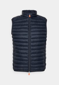 Marineblå polstret vest med høj krave, fuld lynlås foran og en orange lynlåsgreb. Har vandret quiltet tekstur. Uden ærmer.