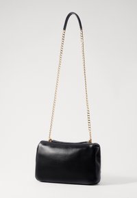 Black leather handbag with a smooth texture, featuring a chain strap with gold accents and a structured rectangular shape.