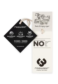 Black tag with white text features icons for waterproof, breathable, and windproof fabrics; beige tag includes animal illustration and care guarantees.