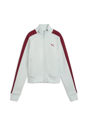 Biała kurtka zapinana na suwak z wysokim kołnierzem, bordowe paski na rękawach, kieszenie na suwak oraz małe bordowe logo Puma na lewej piersi.
