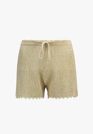 Shorts tricotés beige avec ourlet festonné et taille à cordon, présentant un motif ajouré texturé.