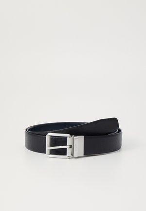 Black leather belt with a textured finish, featuring a silver metal buckle with a brushed texture and a smooth prong for fastening.