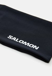Fekete gyapjú nyakpánt, puha tapintással, fehér "SALOMON" logóval az alsó szélen. Téglalap alakú, hajtogatott.