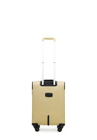 Kofferformaat tas in beige textuurmateriaal met een zwarte basis, dubbele witte telescopische handgreep en vier draaivriendelijke wielen voor mobiliteit.