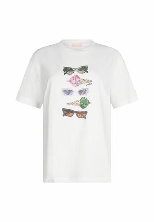 T-shirt en coton blanc présentant un graphique de quatre paires de lunettes de soleil de différentes couleurs : vert, rose, violet et marron, avec des accents décoratifs.