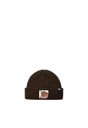 Bonnet en maille marron foncé avec un revers, un écusson représentant un lion et portant l’inscription « King », ainsi qu’une petite étiquette noire avec un logo.