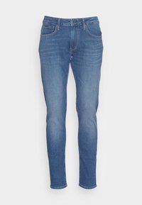 Slim-fit blå denimjeans med standard midja, fem fickor och dragkedja. Materialet har en något blekt textur över hela plagget.