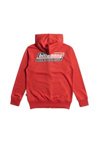 Röd hoodie med en känguruficka, ribbade ärmslut och nederkant. Har en stor svart och vit logotyp på baksidan, med texten "sedan sjuttiotre."