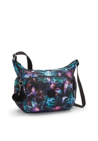Floral crossbody bag with black, blue, and purple pattern. Features a zip closure, adjustable strap, and a furry charm accent.