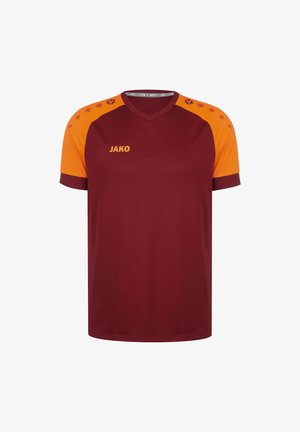 Maglietta sportiva color bordeaux con dettagli arancioni sulle spalle, maniche corte e scollatura a V. Presenta il logo JAKO in giallo a contrasto sul davanti.