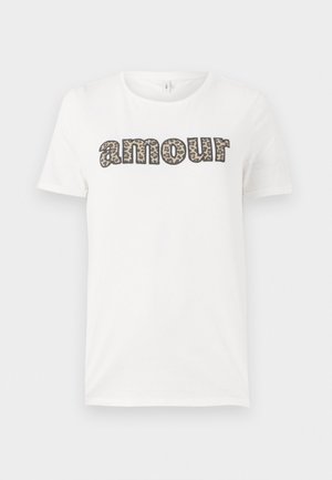 White cotton t-shirt featuring "amour" text in a leopard print design. Short sleeves and a round neckline. Lightweight and casual fit.