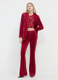 Calliope CINIGLIA - Trousers - rosso