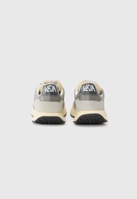 Grey suede and mesh sports shoes with a cream sole, featuring a black logo at the heel and a smooth, textured finish.