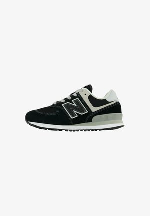 Black and gray athletic shoe with suede and mesh upper, lace-up design, padded collar, and rubber sole with traction patterns.