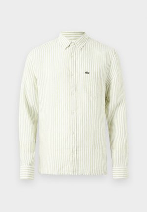 Chemise à manches longues avec boutons, rayures verticales vert clair, col pointu, poche poitrine et petit logo crocodile vert sur la poche.