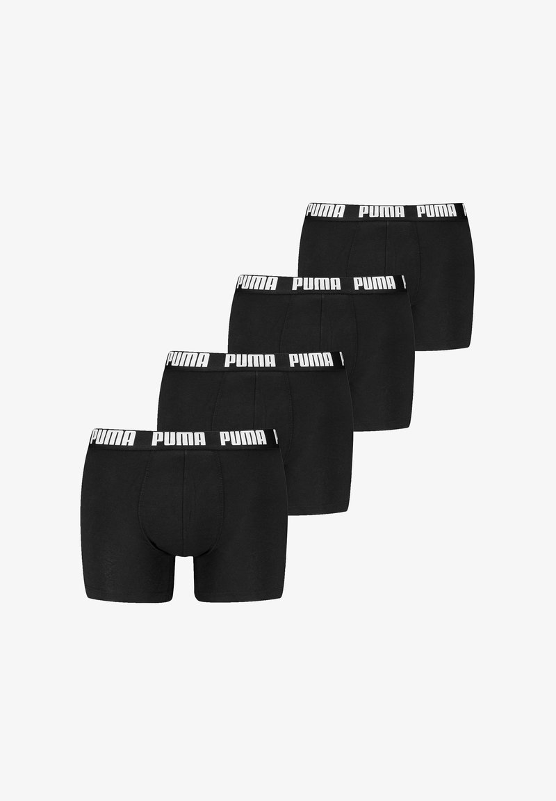 Boxers pretos feitos de tecido macio, com uma ampla cintura branca com o logótipo "PUMA". Cinco pares expostos em fileira.
