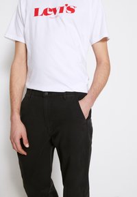 Levi's® XX CHINO EZ TAPER II - Calças - meteorite