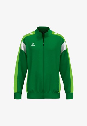 Groen jack met ritssluiting en lichtgroene en witte strepen aan de zijkanten. Heeft een hoge kraag en een zachte stoftextuur. Embleem op de borst.