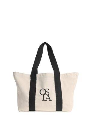 Beige canvas tote bag met zwarte verticale banden en "OSLA" in het zwart geborduurd op het voorste midden.