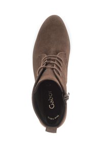 Brown suede ankle boot with round toe, lace-up design, and decorative side accent. Interior features a cushioned footbed with branding.