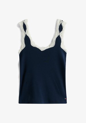 Canotta a coste color navy con dettagli in pizzo bianco sullo scollo e sulle asole. Presenta una vestibilità aderente e un'orlo dritto.