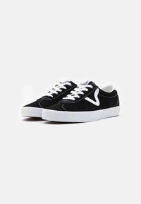 Black suede sneakers with white accents, featuring a rounded toe, lace-up design, and a white rubber sole. Stitched detailing on the upper.