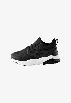 Black athletic shoe with a textured fabric upper, contrasting white midsole, and a rubber outsole featuring a gripping pattern.
