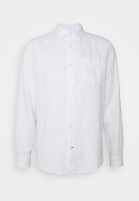 Camicia bianca a maniche lunghe, con bottoni, realizzata in cotone, dotata di taschino sul petto, colletto standard e chiusura con bottoni lungo il davanti.