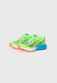 Neon green athletic shoes featuring a mesh upper with black accents, blue and orange details, and a textured sole for grip.