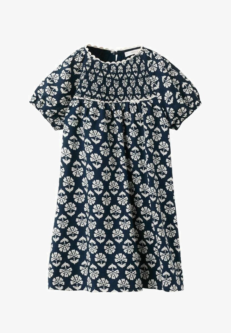 Robe bleu marine avec motif floral blanc, corsage smocké, manches courtes bouffantes et bordure d'encolure festonnée.