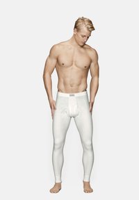 Hvide lange underbukser lavet af glat stof. Har et tætsiddende design med en bred elastik og en frontlomme. Uden dekoration, minimalistisk stil.