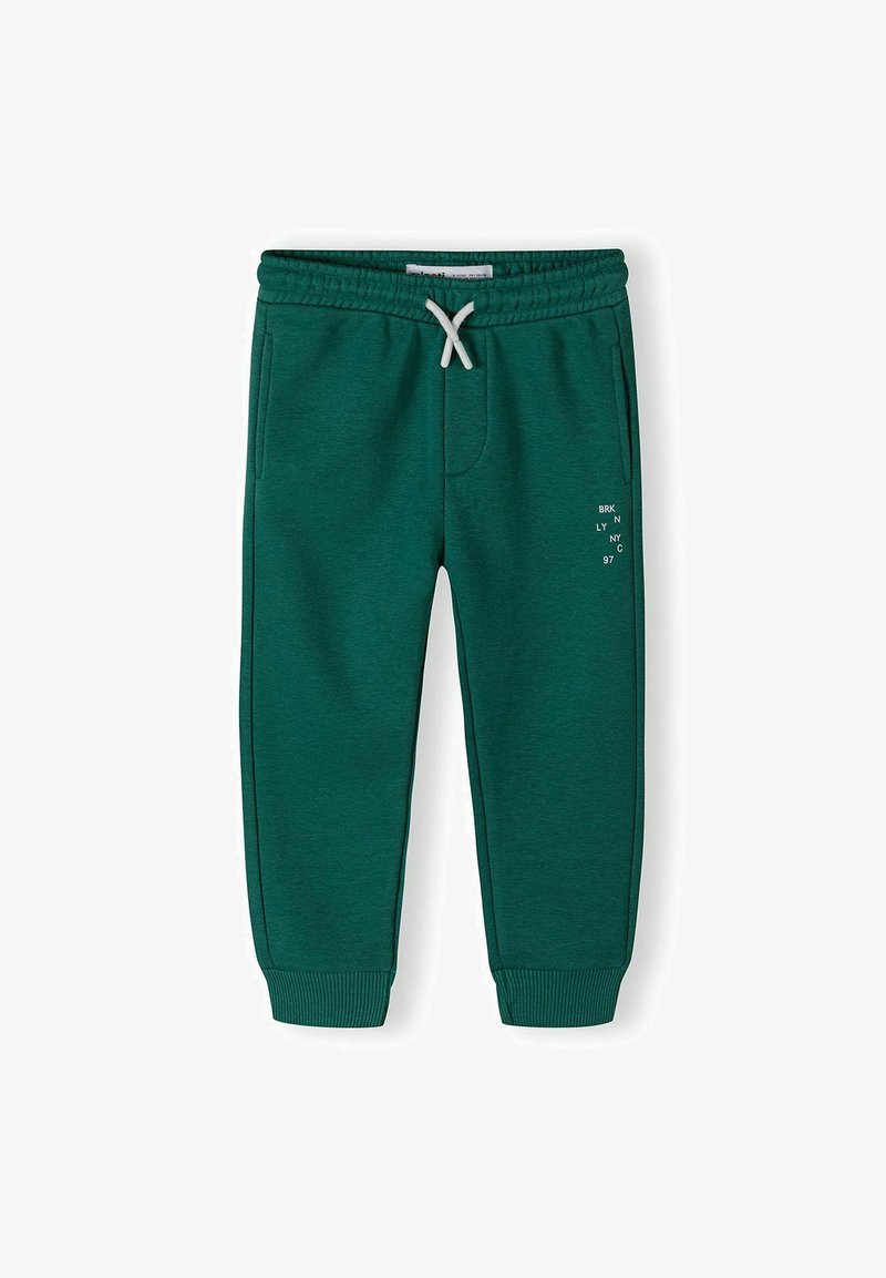 Gröna sweatpants i mjukt material, med elastisk midja och dragsko, sidofickor och tryckt textdesign på benet.