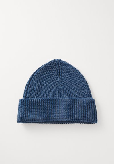 Knit beanie in dark blue, featuring a ribbed texture and rolled cuff. Designed with a snug fit and a tapered crown shape.