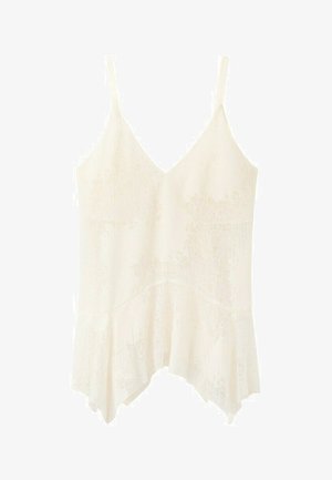 Camiseta blanca sin mangas con escote en V, tirantes delgados ajustables, detalles de encaje y dobladillo asimétrico tipo pañuelo.