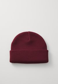 Knitted maroon beanie with a folded cuff. Textured fabric offers stretch and warmth, featuring a simple, seamless design.