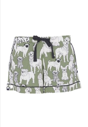 Green cotton shorts featuring a dog pattern in black and white. The design includes various dog breeds, with a black drawstring and trim.
